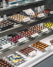Bonbons displayed in a case in storefront